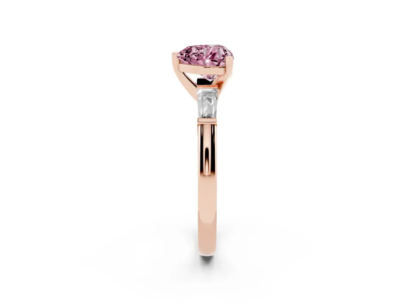 Fancy Pink Heart Cut Diamond Solitaire Ring Set in Rose gold with Tapered Baguette Side Stones and Prong Setting