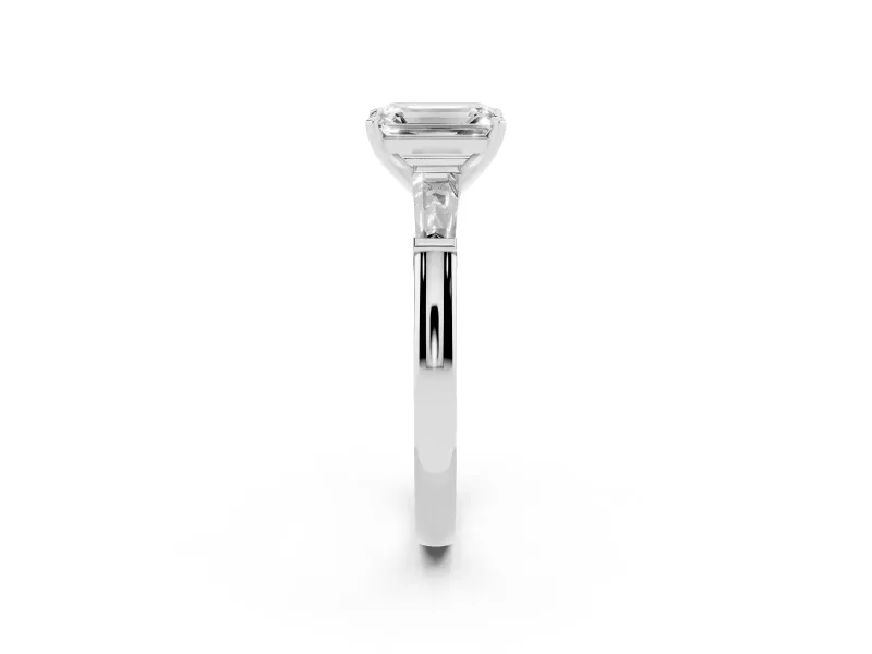 Emerald Cut Diamond Solitaire Ring Set in Platinum with Tapered Baguette Side Stones and Prong Setting