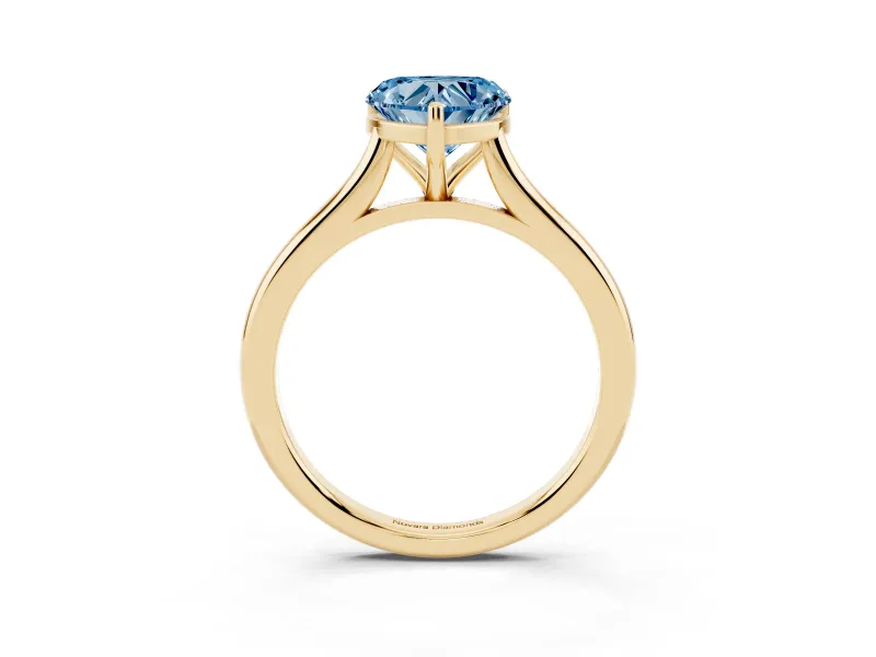 Fancy Blue Heart Cut Diamond Solitaire Ring Set in Yellow gold with Cathedral Band and Prong Setting