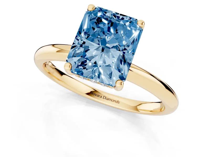 Fancy Blue Radiant Cut Diamond Solitaire Engagement Ring Set in Yellow gold with Prong Setting and Polished Band