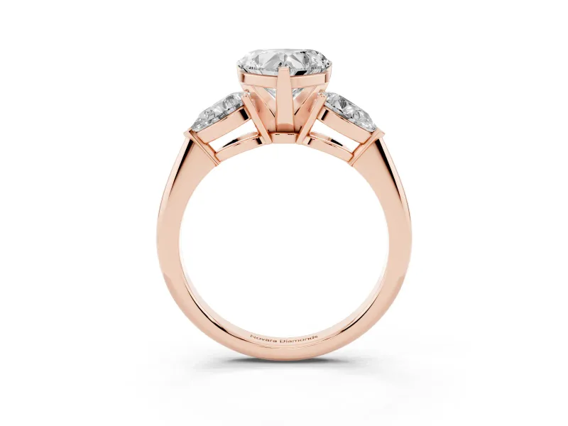 Three-Stone Heart Cut Diamond Ring Set in Rose gold with Pear Side Stones and Prong Setting