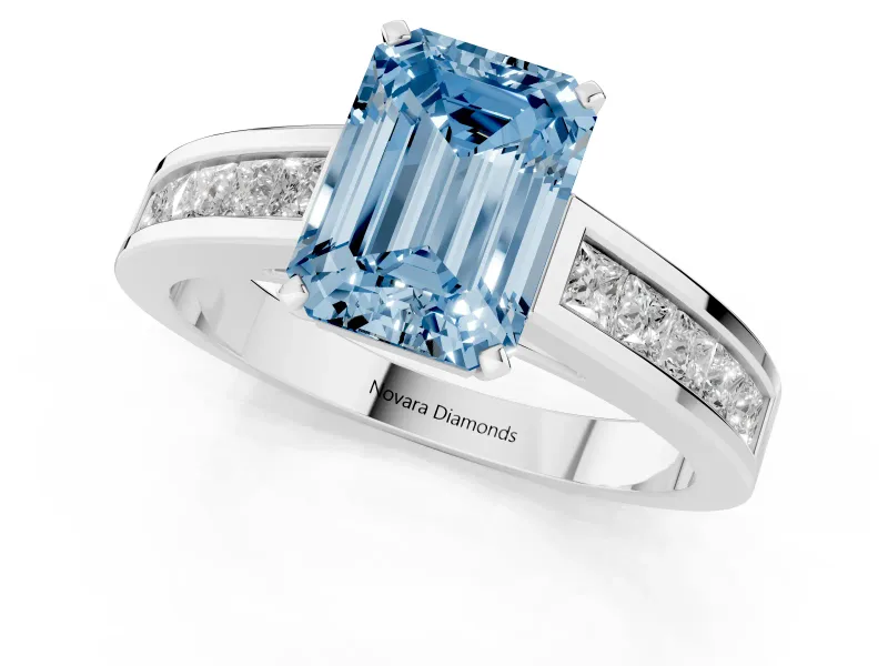 Fancy Blue Emerald Cut Diamond Solitaire Ring Set in Silver with Channel-Set Band and Prong Setting