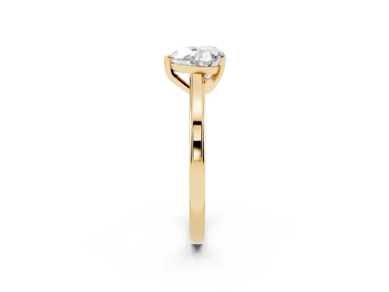 Heart Cut Diamond Solitaire Ring Set in Yellow gold with Prong Setting and Classic Band