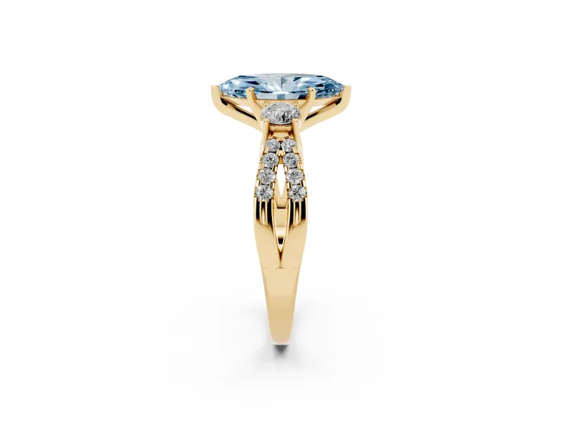 Fancy Blue Marquise Cut Diamond Three-Stone Ring Set in Yellow gold with Pavé Split Shank and Prong Setting