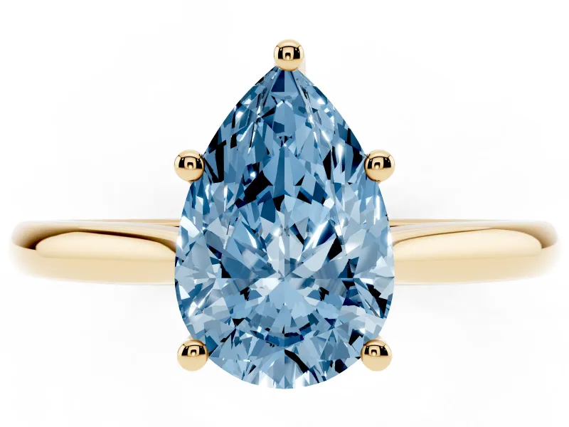 Fancy Blue Pear Cut Diamond Solitaire Ring Set in Yellow gold with Cathedral Band and Prong Setting