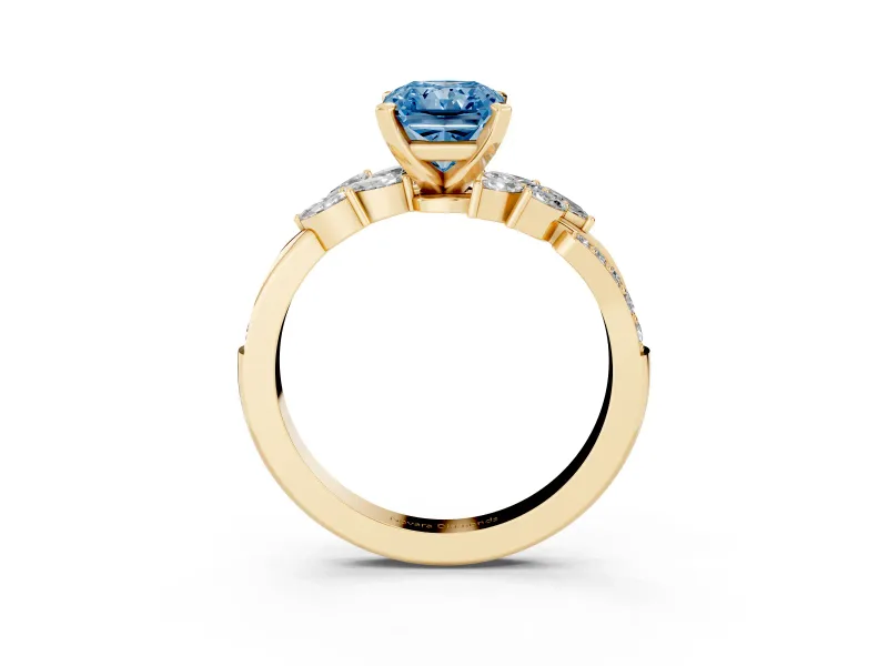 Fancy Blue Radiant Cut Diamond Solitaire Ring Set in Yellow gold with Marquise Twist Band and Prong Setting