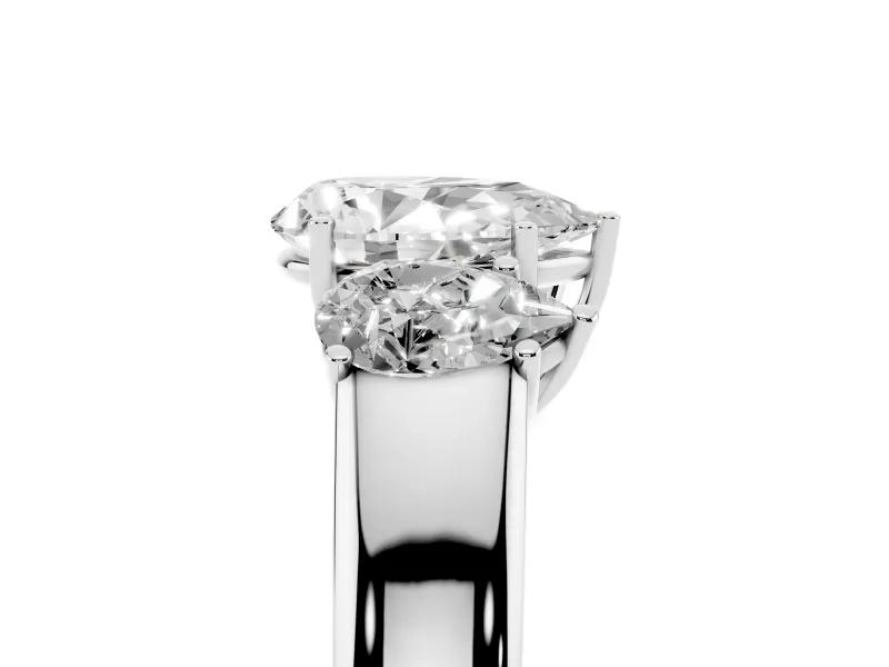 Three-Stone Pear Cut Diamond Ring Set in Silver with Matching Prong Settings and Plain Band