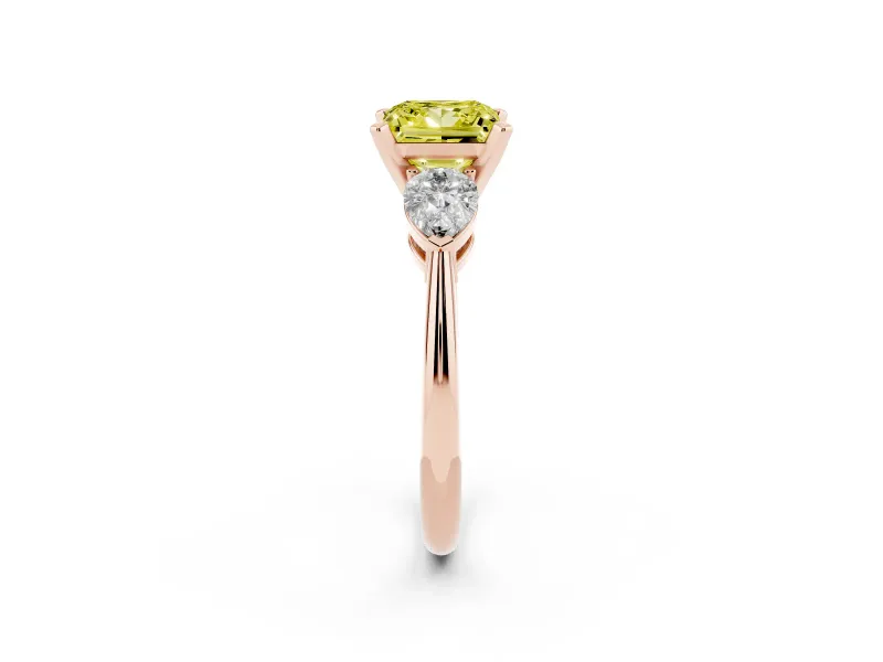 Fancy Yellow Three-Stone Princess Cut Diamond Ring Set in Rose gold with Pear Side Stones and Prong Setting
