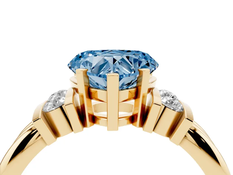 Fancy Blue Three-Stone Heart Cut Diamond Channel Set Ring Set in Yellow gold with Bar Prongs