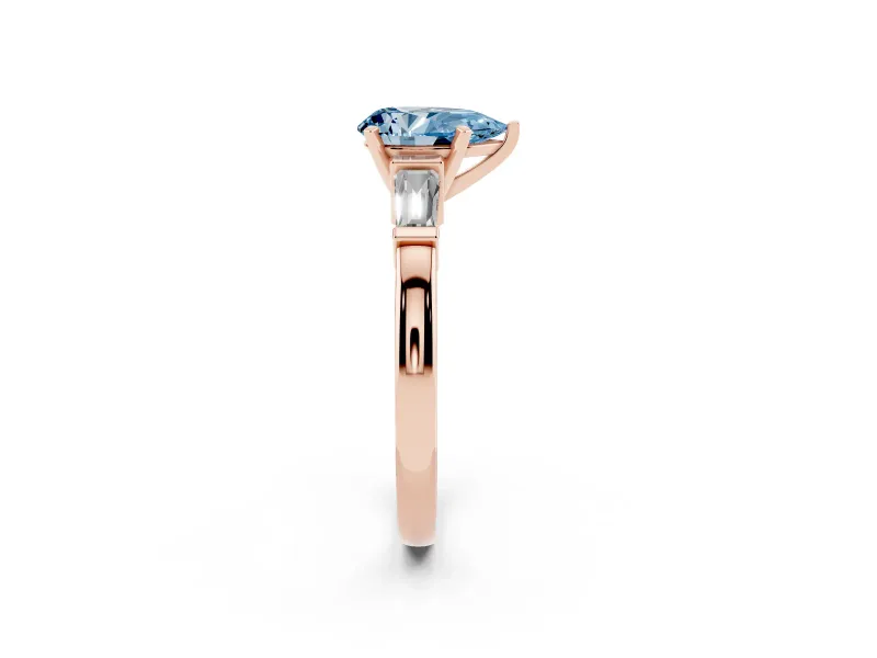 Fancy Blue Pear Cut Diamond Solitaire Ring Set in Rose gold with Tapered Baguette Accents and Prong Setting