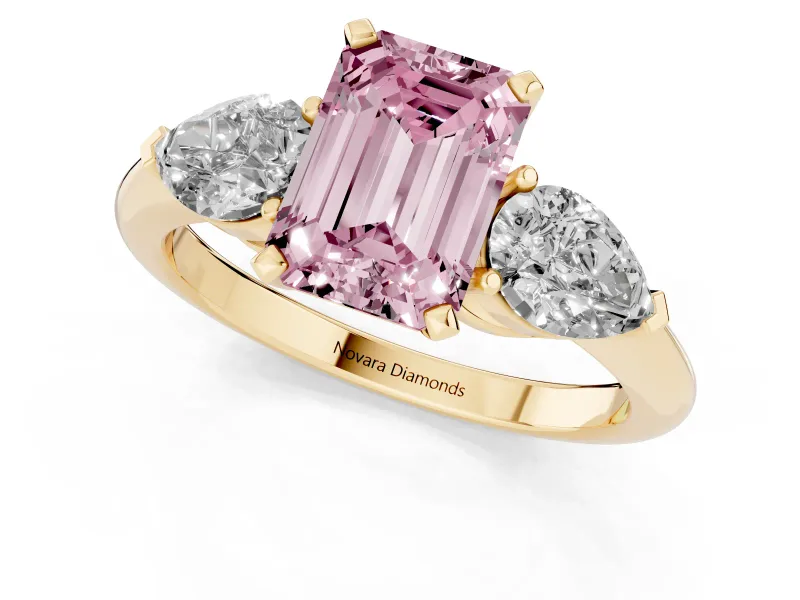 Fancy Pink Three-Stone Emerald Cut Diamond Ring Set in Yellow gold with Pear Side Stones and Prong Setting