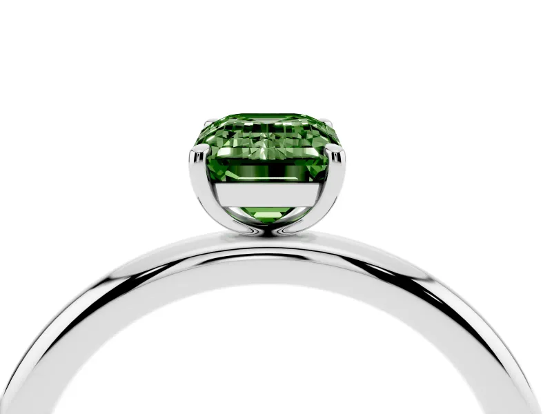 Fancy Green Emerald Cut Diamond Solitaire Ring Set in White gold with Prong Setting on a Polished Plain Band