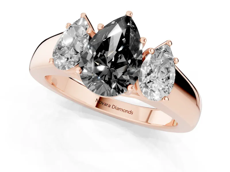 Fancy Black Three-Stone Pear Cut Diamond Ring Set in Rose gold with Matching Prong Settings and Plain Band