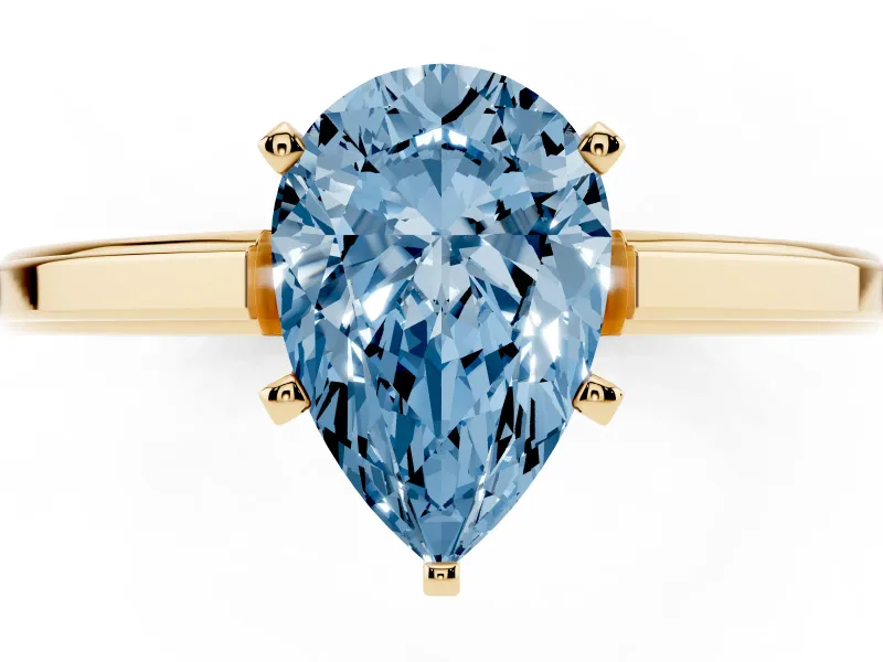 Fancy Blue Pear Cut Diamond Solitaire Ring Set in Yellow gold with Prong Setting and Classic Band