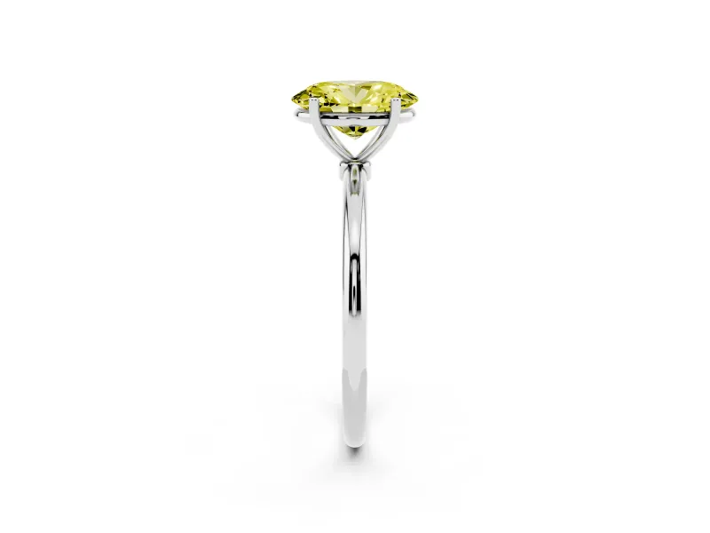 Fancy Yellow Oval Cut Diamond Solitaire Engagement Ring Set in Platinum with Thin Band and Prong Setting