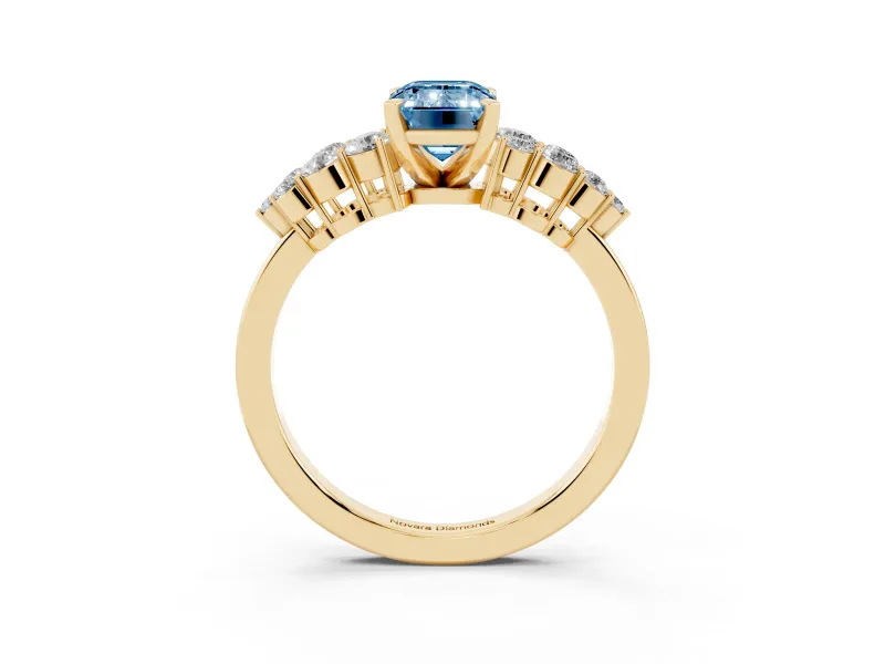 Fancy Blue Emerald Cut Diamond Cluster Engagement Ring Set in Yellow gold with Pavé Band and Prong Setting