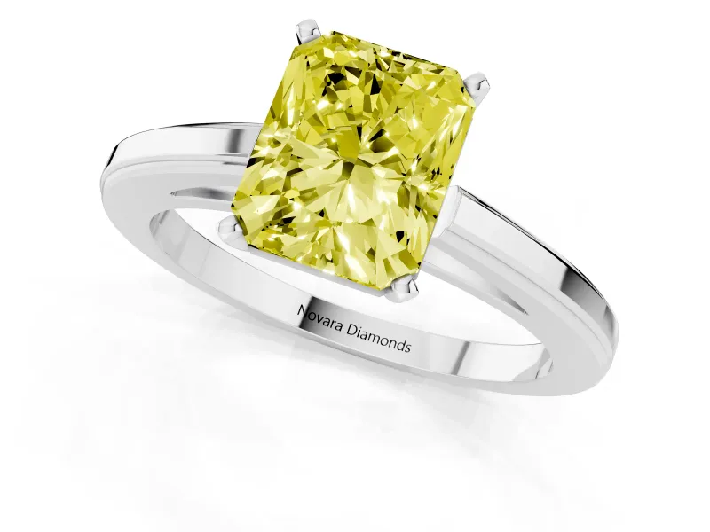 Fancy Yellow Radiant Cut Diamond Solitaire Ring Set in Platinum with Prong Setting and Classic Band