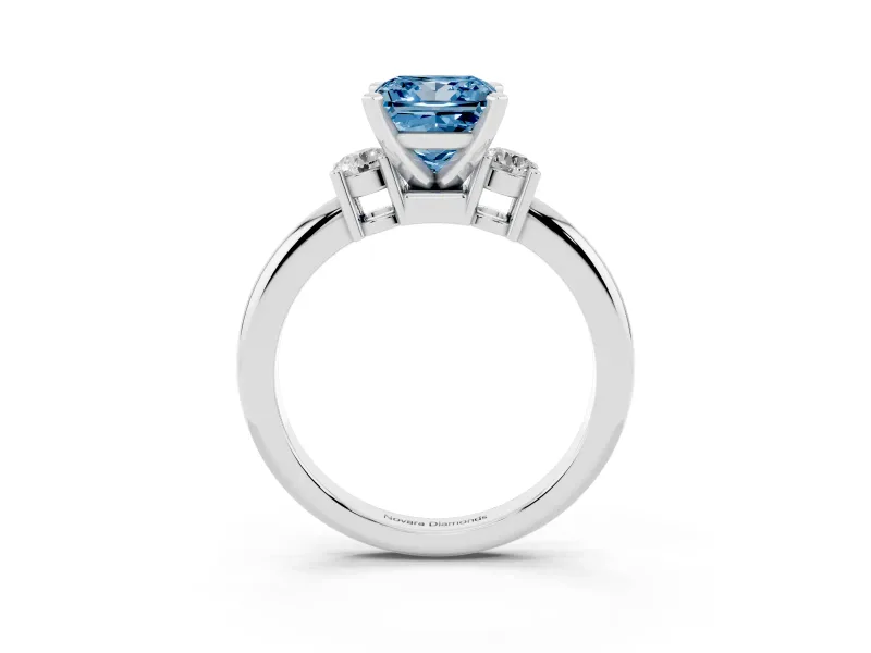 Fancy Blue Three-Stone Princess Cut Diamond Ring Set in Platinum with Prong Setting and Plain Band