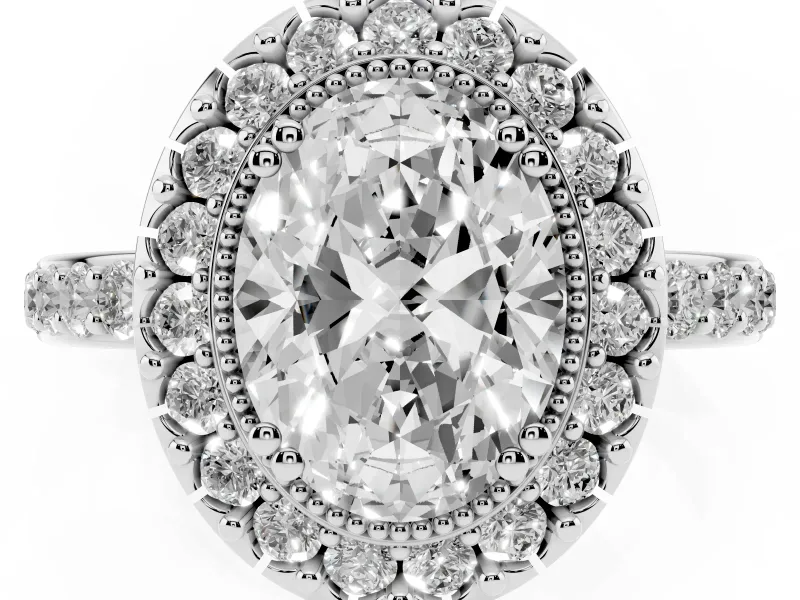 Oval Cut Diamond Halo Ring Set in White gold with Pavé Shank and Prong Setting
