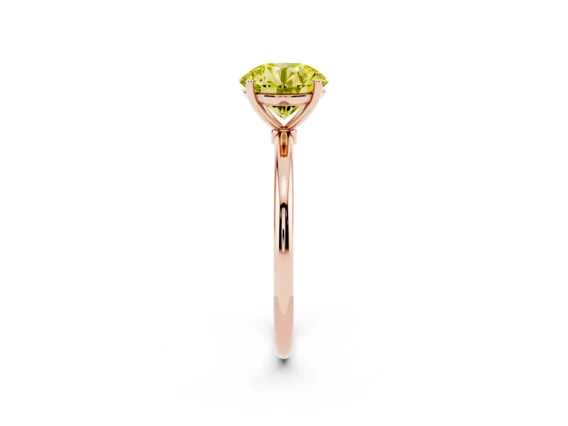 Fancy Yellow Round Cut Diamond Solitaire Engagement Ring Set in Rose gold with Thin Band and Prong Setting