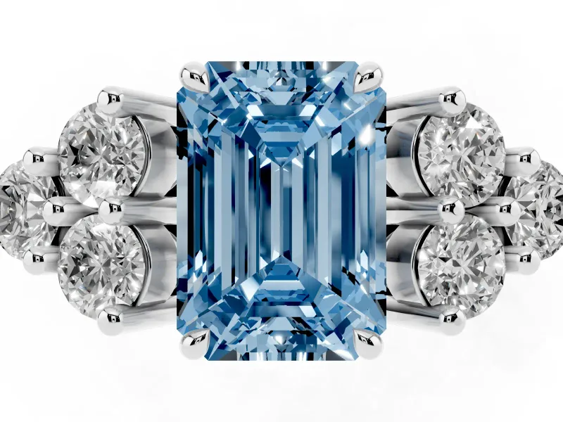 Fancy Blue Emerald Cut Diamond Solitaire Ring Set in Platinum with Cluster Accents on Each Side
