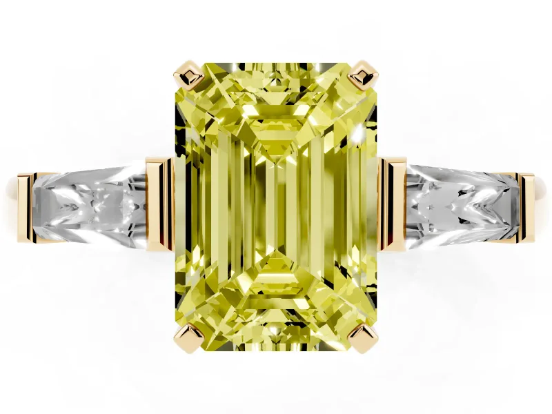 Fancy Yellow Emerald Cut Diamond Solitaire Ring Set in Yellow gold with Tapered Baguette Side Stones and Prong Setting