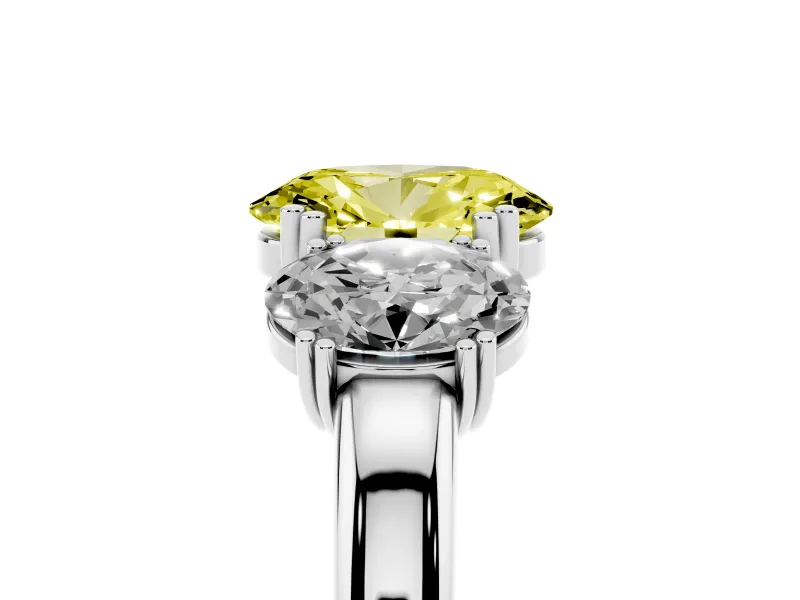Fancy Yellow Oval Cut Diamond Three-Stone Ring Set in Silver with Polished Band and Prong Setting