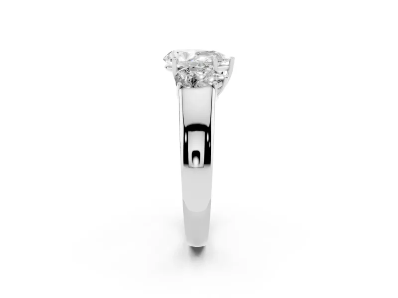 Three-Stone Pear Cut Diamond Ring Set in White gold with Matching Prong Settings and Plain Band