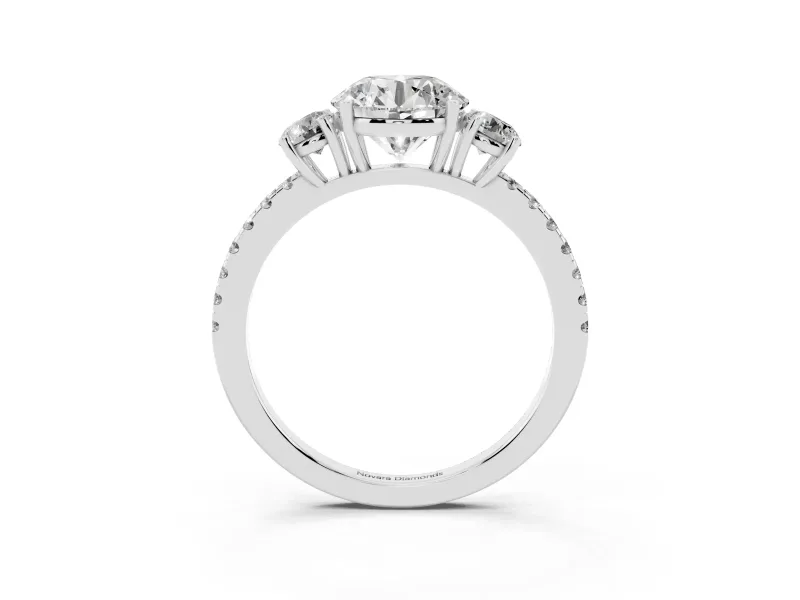Round Cut Diamond Three-Stone Ring Set in Platinum with Pavé Band and Graduated Sides