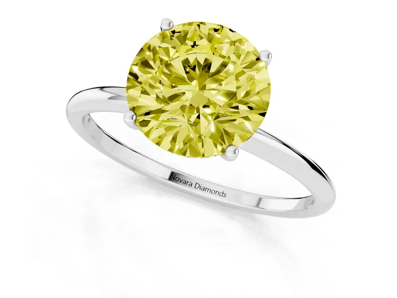 Fancy Yellow Round Cut Diamond Solitaire Engagement Ring Set in Silver with Thin Band and Prong Setting