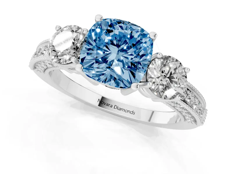 Fancy Blue Cushion Cut Diamond Three-Stone Ring Set in White gold with Round Side Stones and Pavé Band