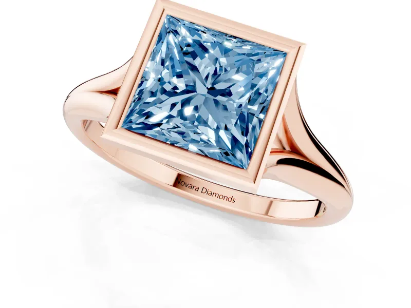 Fancy Blue Bezel Set Princess Cut Diamond Solitaire Ring Set in Rose gold with Tapered Band