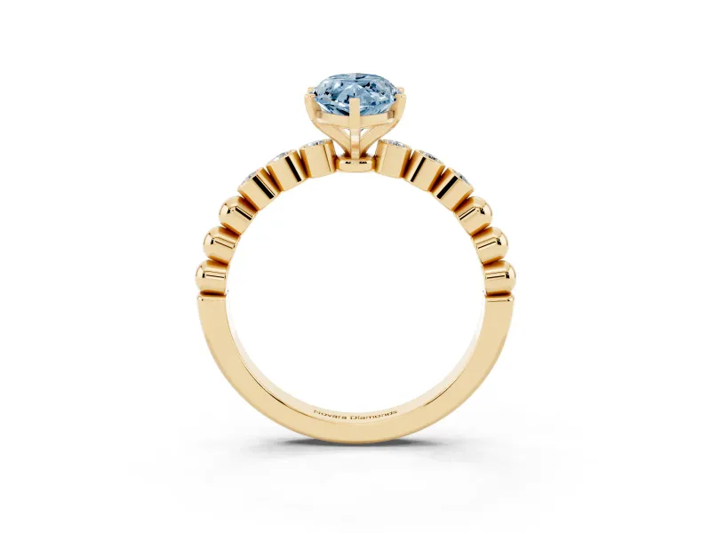 Fancy Blue Marquise Cut Diamond Solitaire Engagement Ring Set in Yellow gold with Bezel Accents on Beaded Band
