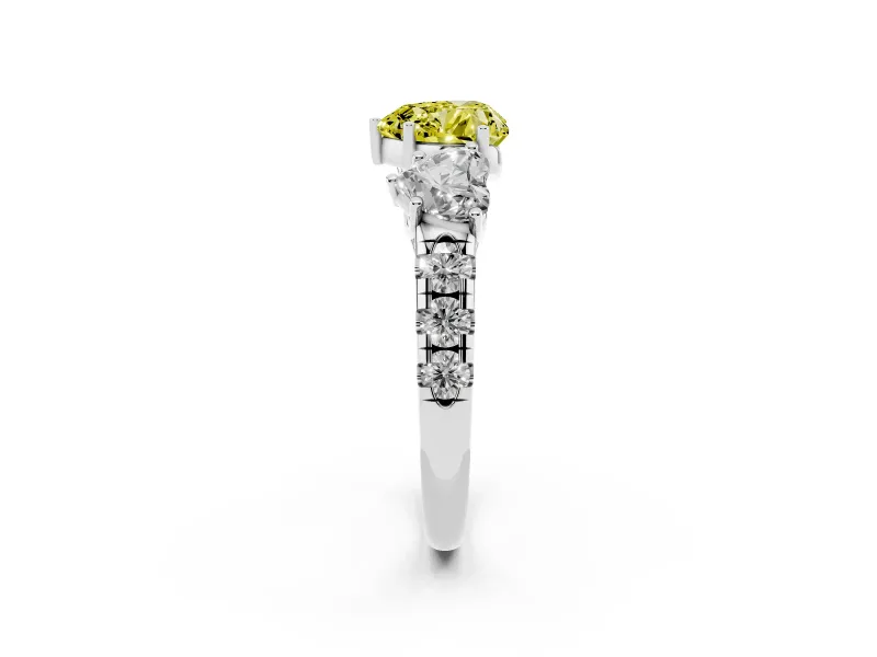 Fancy Yellow Heart Cut Diamond Three-Stone Ring Set in White gold with Pavé Band