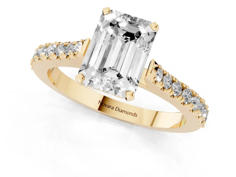 Emerald Cut Diamond Solitaire Engagement Ring Set in Yellow gold with Delicate Pavé Band and Prong Setting