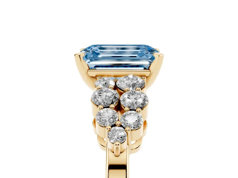 Fancy Blue Emerald Cut Diamond Cluster Engagement Ring Set in Yellow gold with Pavé Band and Prong Setting