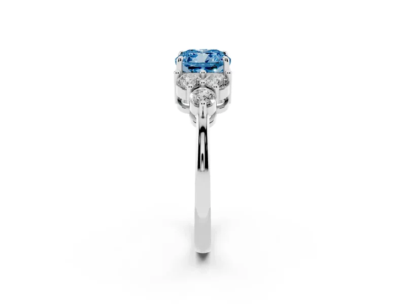 Fancy Blue Cushion Cut Diamond Solitaire Ring Set in White gold with Cluster Accents on Each Side
