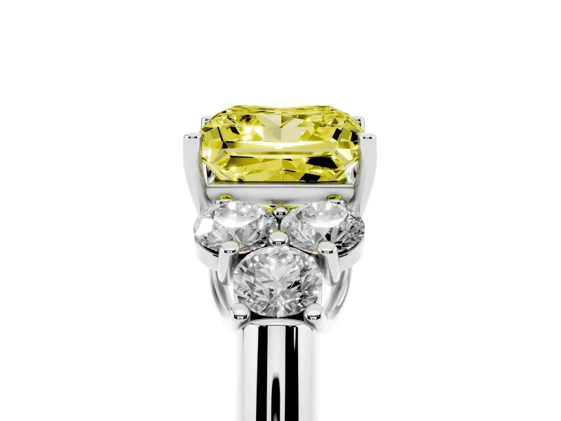 Fancy Yellow Princess Cut Diamond Cluster Ring Set in Platinum with Round Accent Stones and Prong Setting on a Plain Band