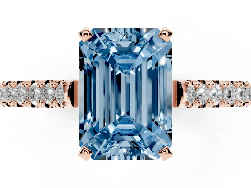 Fancy Blue Emerald Cut Diamond Solitaire Engagement Ring Set in Rose gold with Delicate Pavé Band and Prong Setting