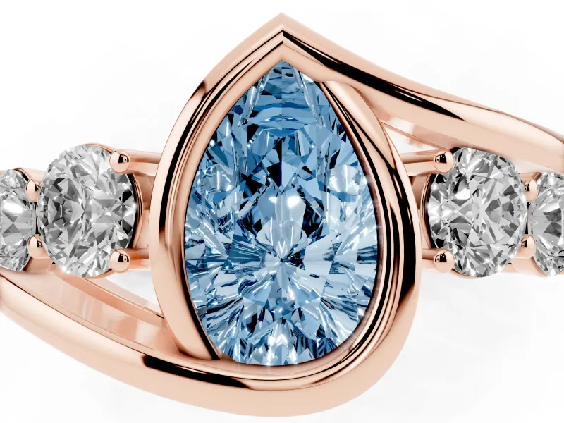 Fancy Blue Pear Cut Diamond Bezel Bypass Ring Set in Rose gold with Round Accents