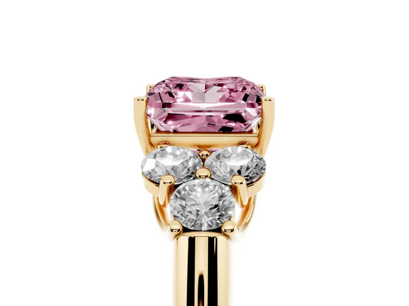 Fancy Pink Princess Cut Diamond Cluster Ring Set in Yellow gold with Round Accent Stones and Prong Setting on a Plain Band