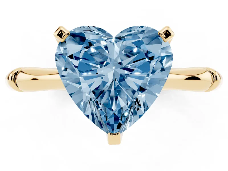 Fancy Blue Heart Cut Diamond Solitaire Ring Set in Yellow gold with Bamboo Band and Prong Setting