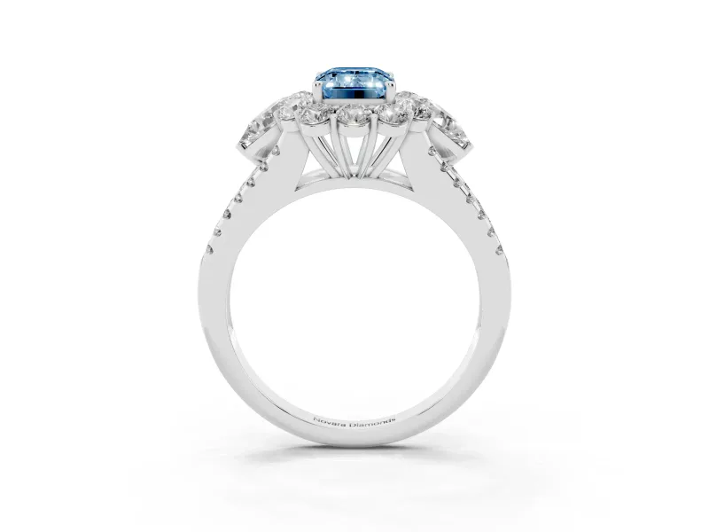 Fancy Blue Emerald Cut Diamond Halo Split Shank Engagement Ring Set in White gold with Prong-Held Center Stone