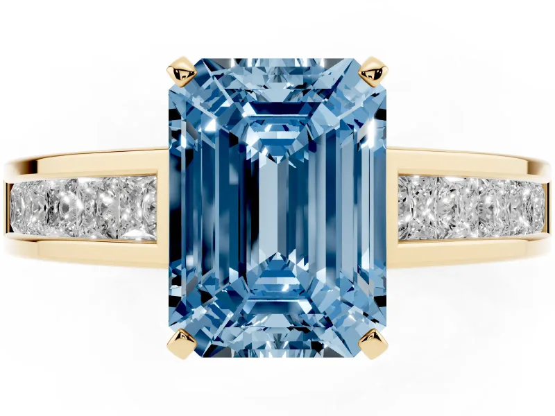 Fancy Blue Emerald Cut Diamond Solitaire Ring Set in Yellow gold with Channel-Set Band and Prong Setting