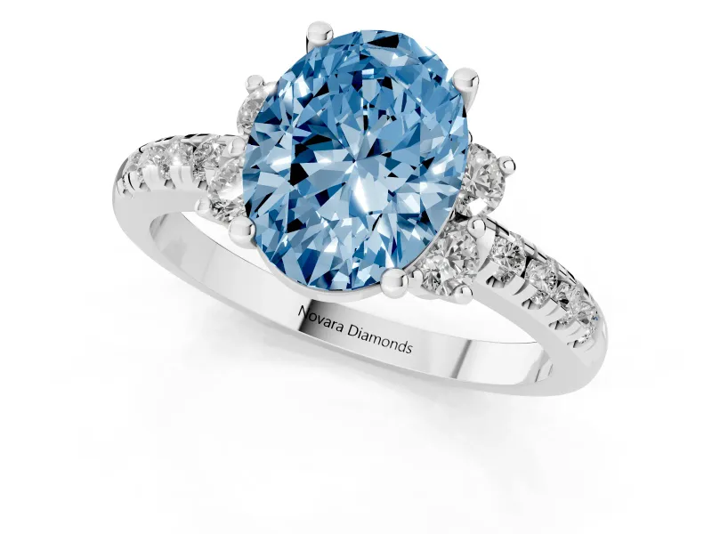 Oval Side Stone Pave Engagement Ring Setting for a Fancy Blue Lab-Grown Diamond | Paired Round Accents | Sterling Silver