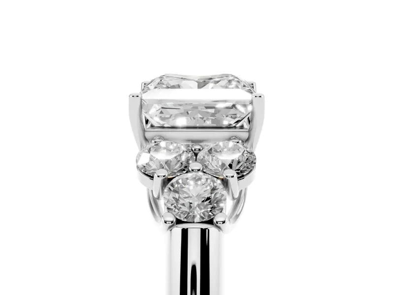 Princess Cut Diamond Cluster Ring Set in Silver with Round Accent Stones and Prong Setting on a Plain Band