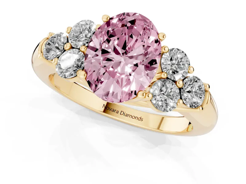 Fancy Pink Oval Cut Diamond Cluster Ring Set in Yellow gold with Round Accent Stones and Prong Setting on a Plain Band