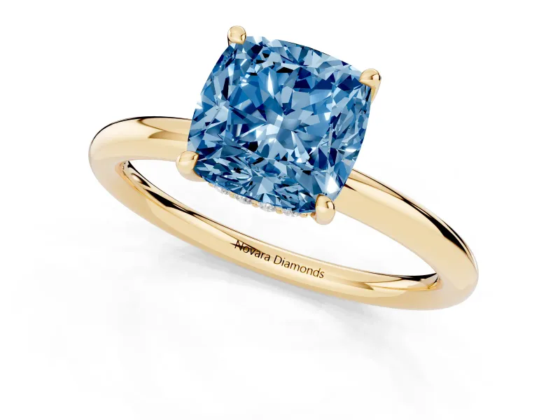 Fancy Blue Cushion Cut Diamond Solitaire Ring Set in Yellow gold with Thin Band and Prong Setting