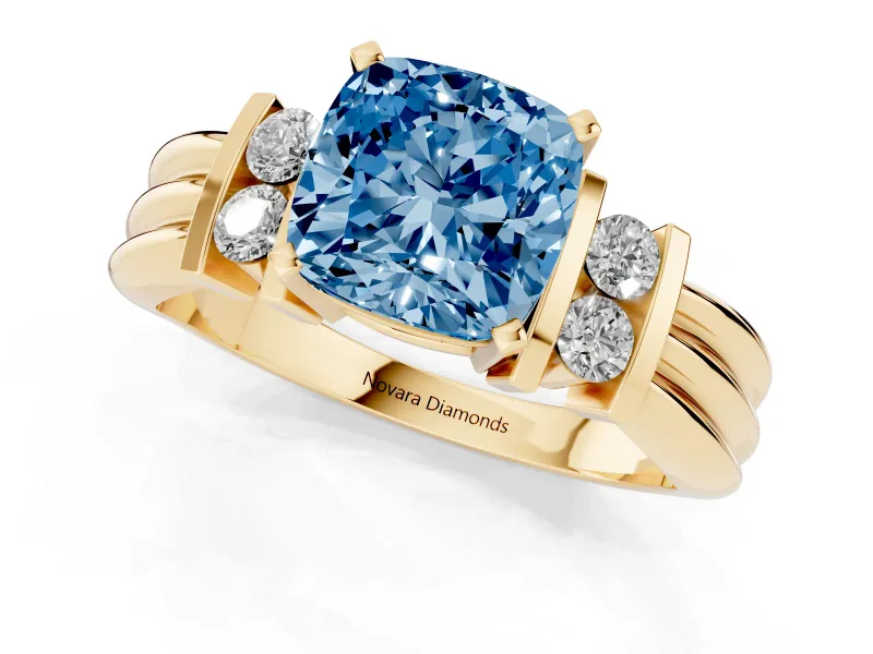 Fancy Blue Three-Stone Cushion Cut Diamond Channel Set Ring Set in Yellow gold with Bar Prongs