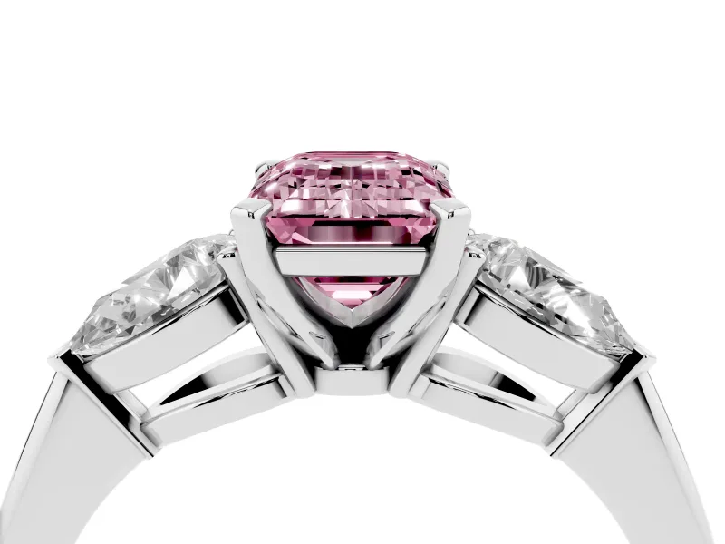Fancy Pink Three-Stone Emerald Cut Diamond Ring Set in White gold with Pear Side Stones and Prong Setting